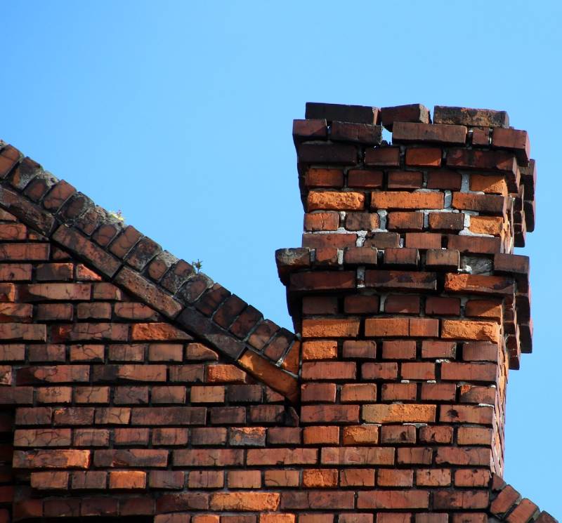 Signs Your Sunny Isles Beach Home Needs a Chimney Inspection Damaged chimney on an Sunny Isles Beach home showing cracks and missing mortar